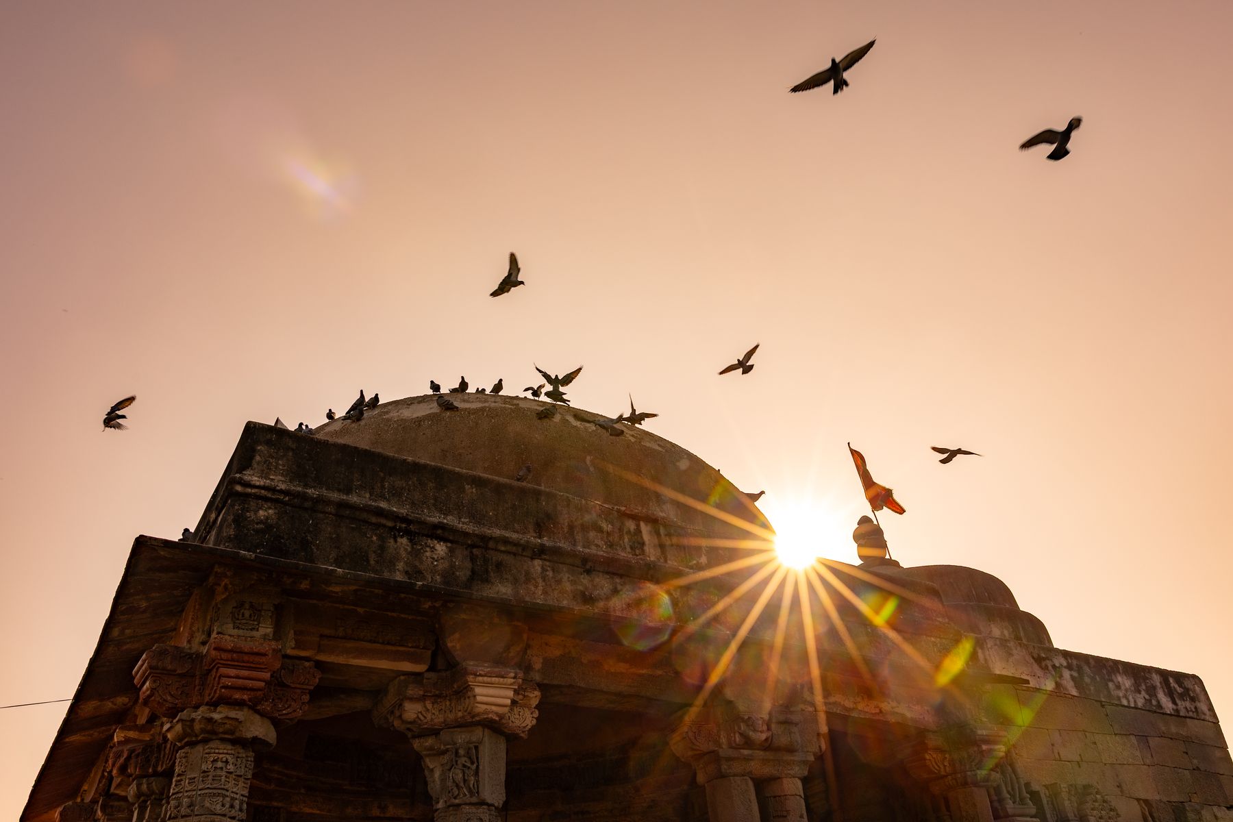 Temple Roof Silhouette With Birds And Sun